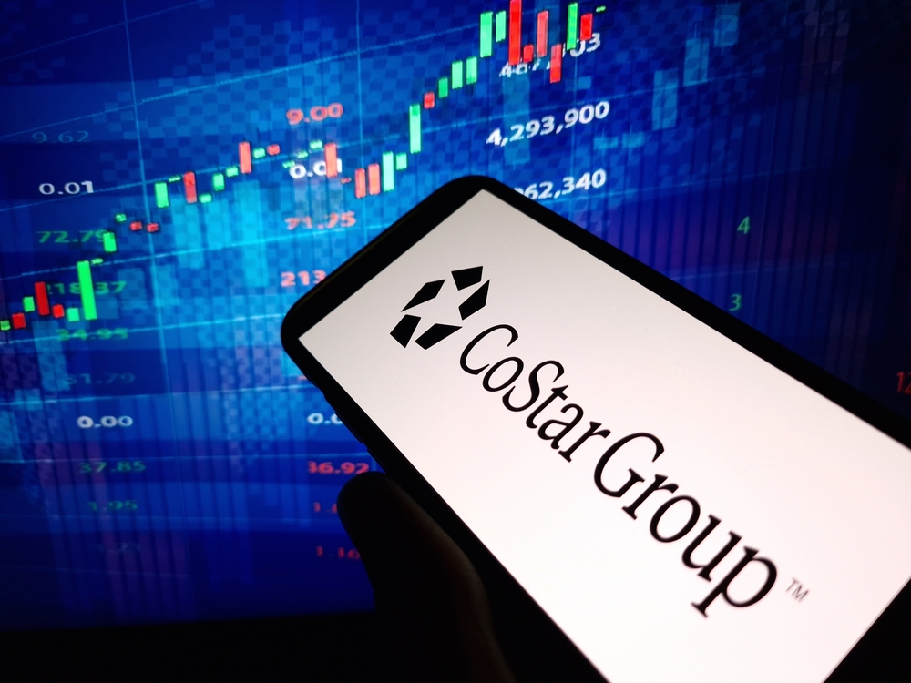 Real Estate - Costar Group, Inc_ logo on phone and stock chart-by Piotr Swat via Shutterstock